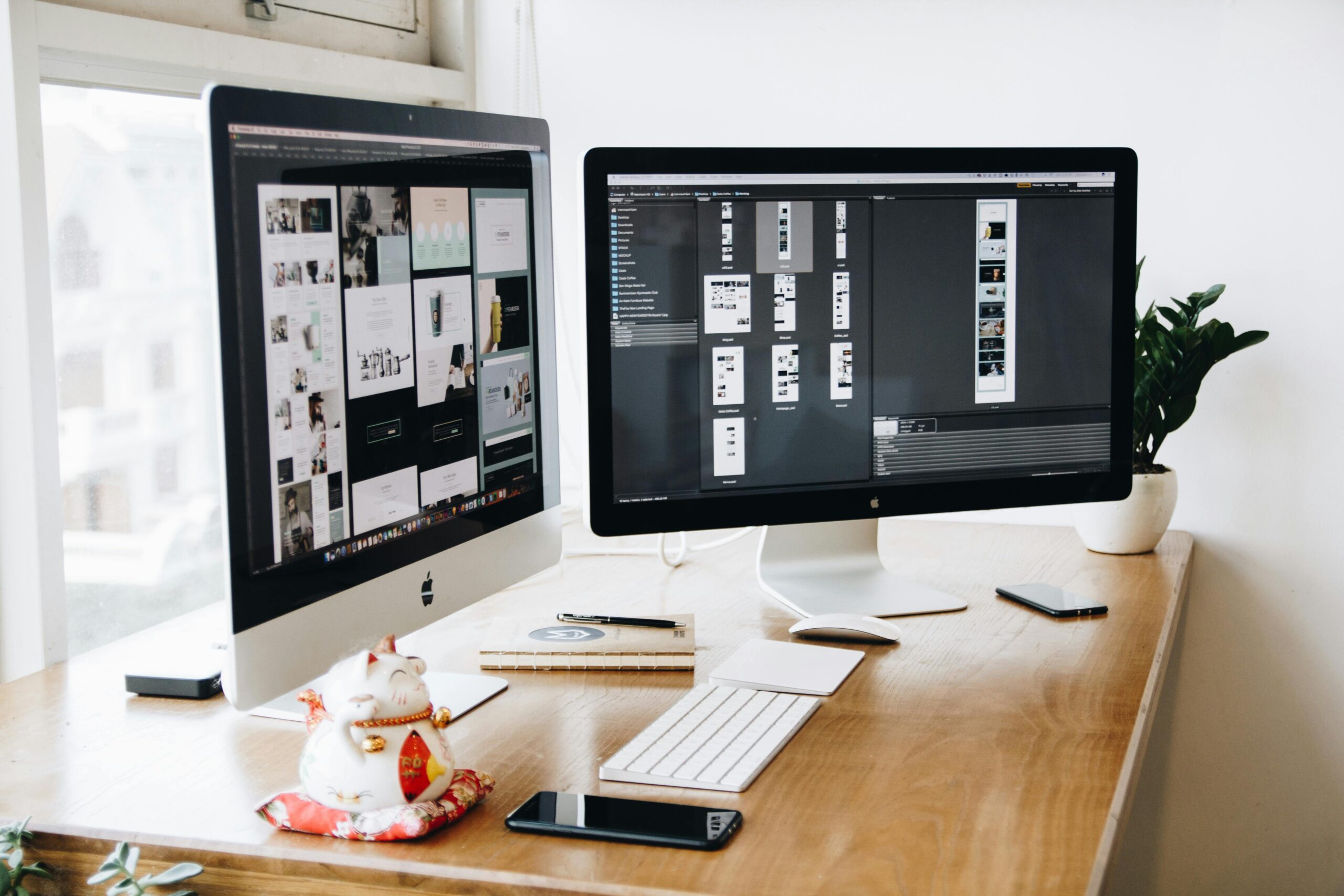 A well-organized design workspace with dual monitors and design software on display.